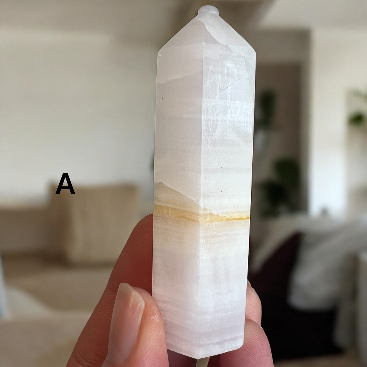 Pink calcite tower 7-10cm UV reactive