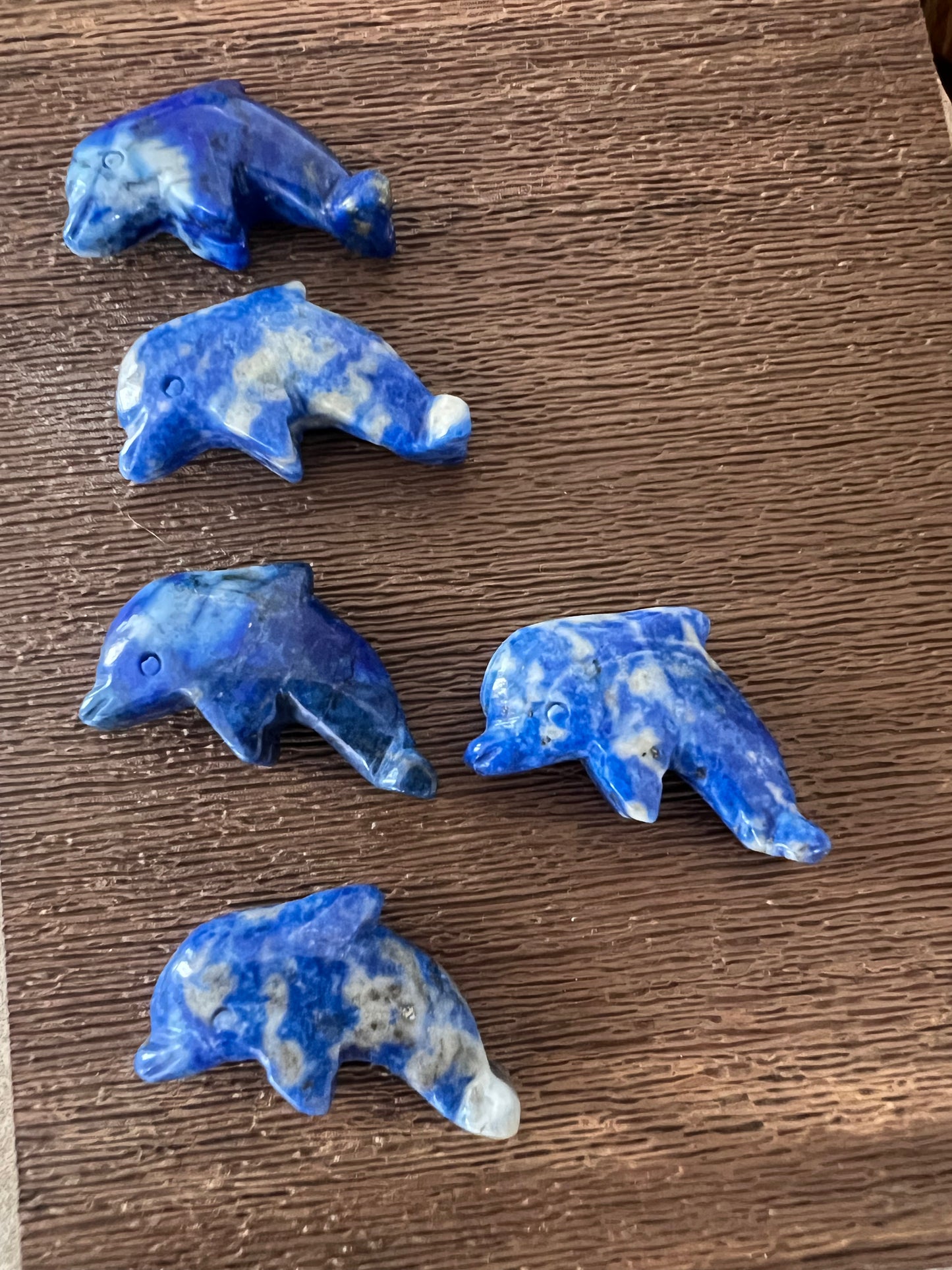 Lapis dolphin carvings