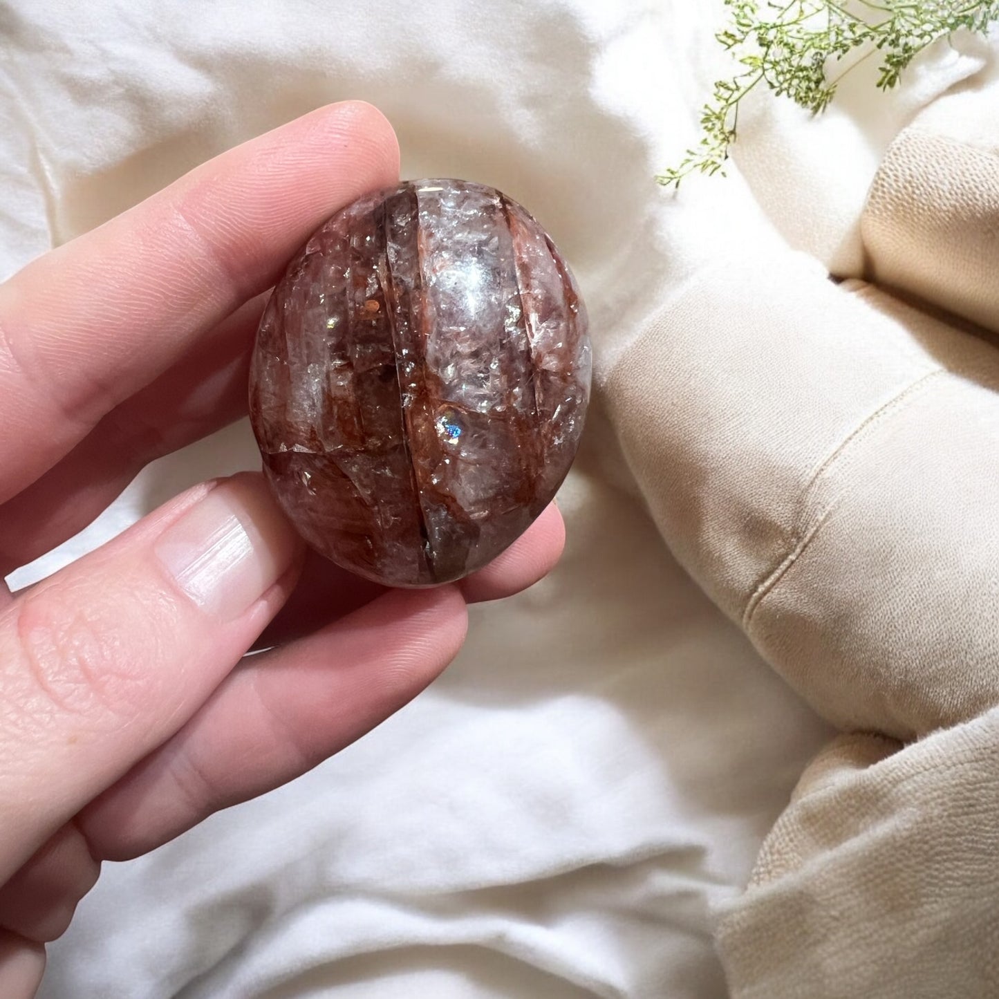 A grade Fire Quartz palmstone medium