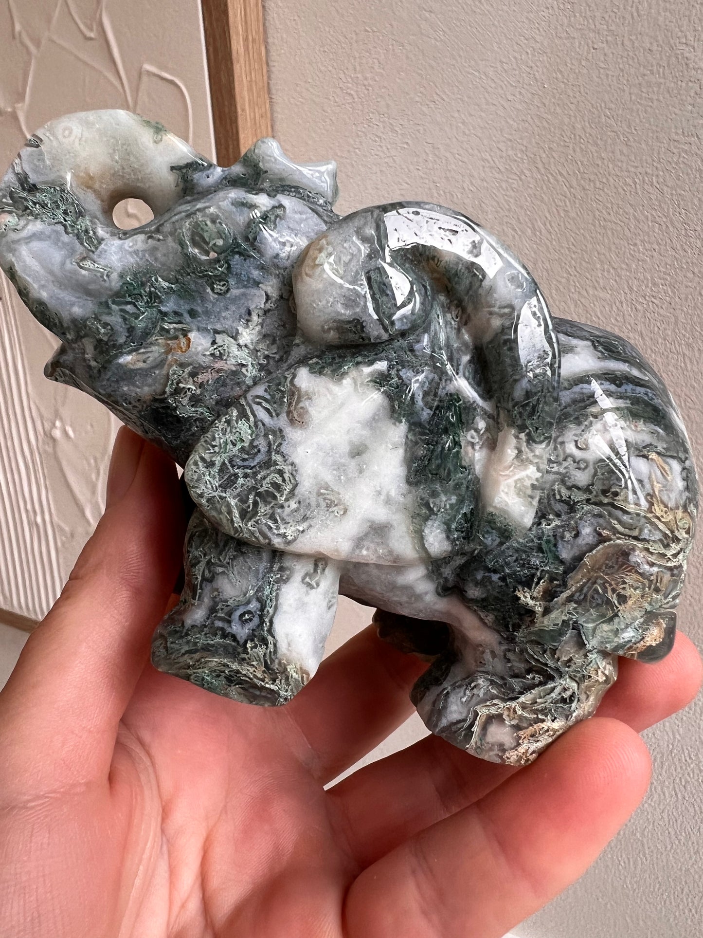 Scenic moss elephant carving