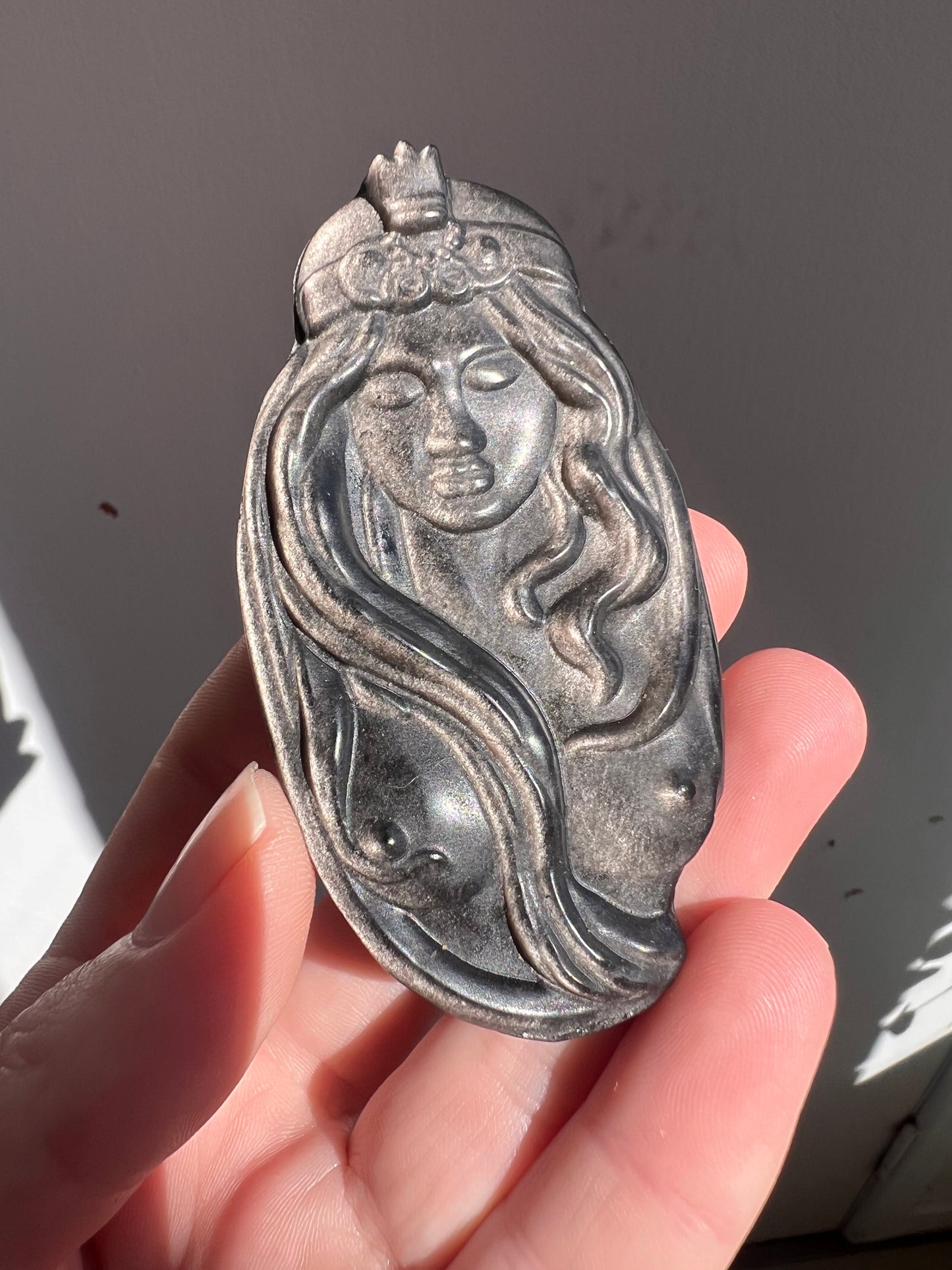 Silver obsidian women carving