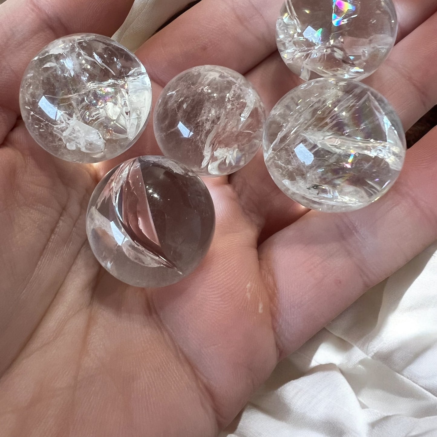 Rainbow filled clear quartz spheres intuitively chosen