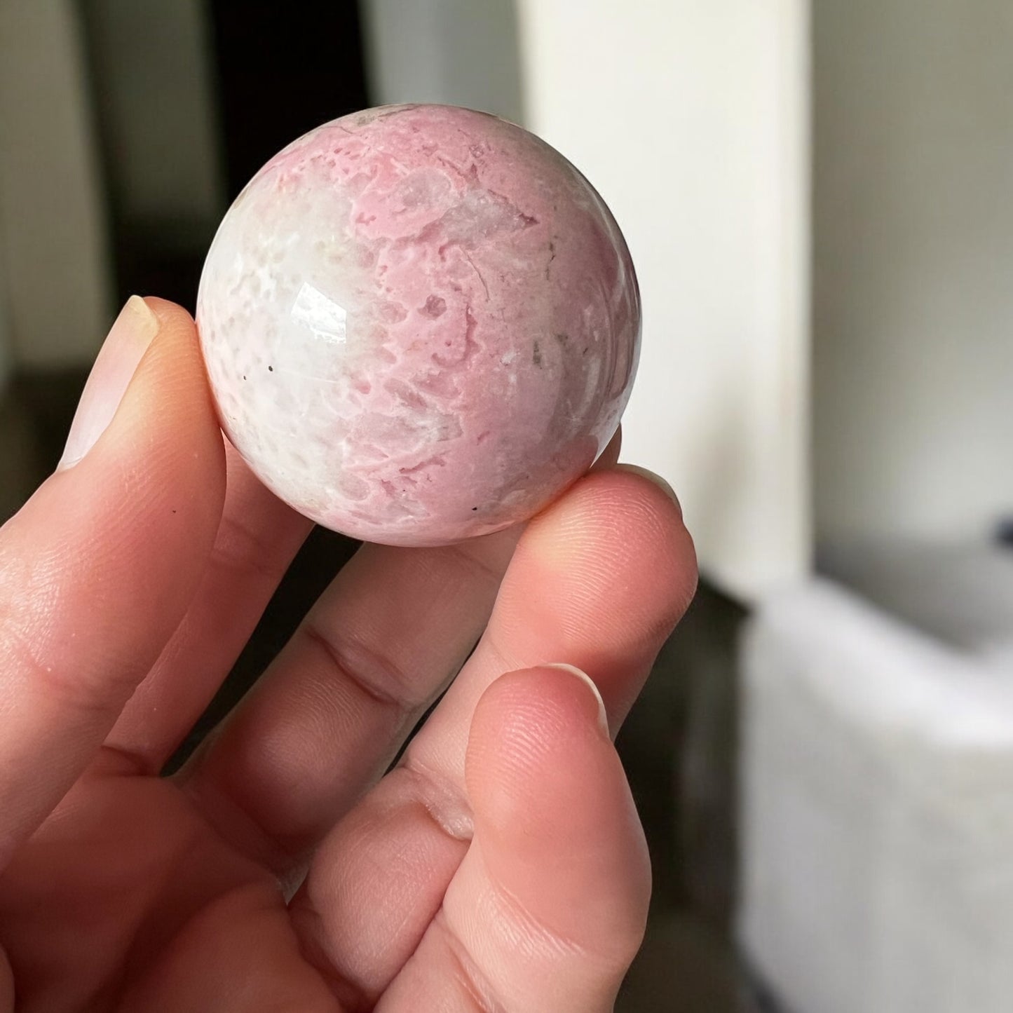 Pink Rhodonite sphere 12cmD