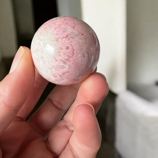 Pink Rhodonite sphere 12cmD