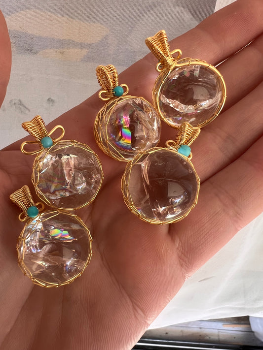 Rainbow filled clear quartz wire wrapped pendants