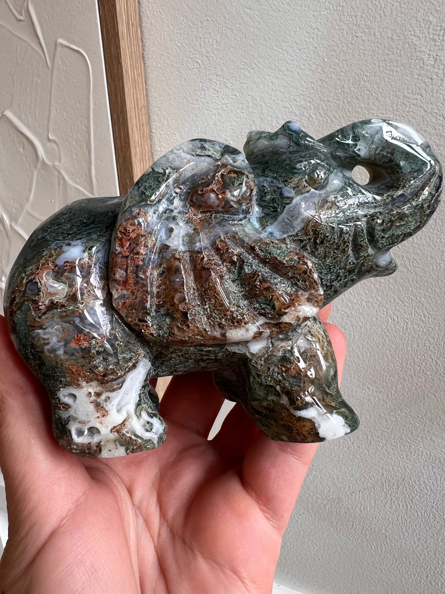 Scenic moss elephant carving