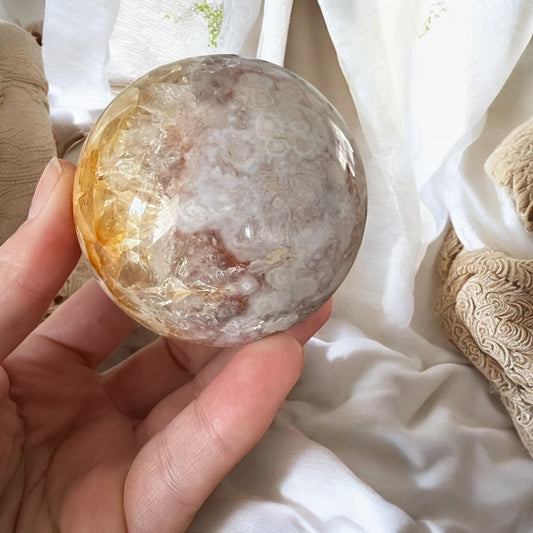 Pink amethyst sphere with inclusions