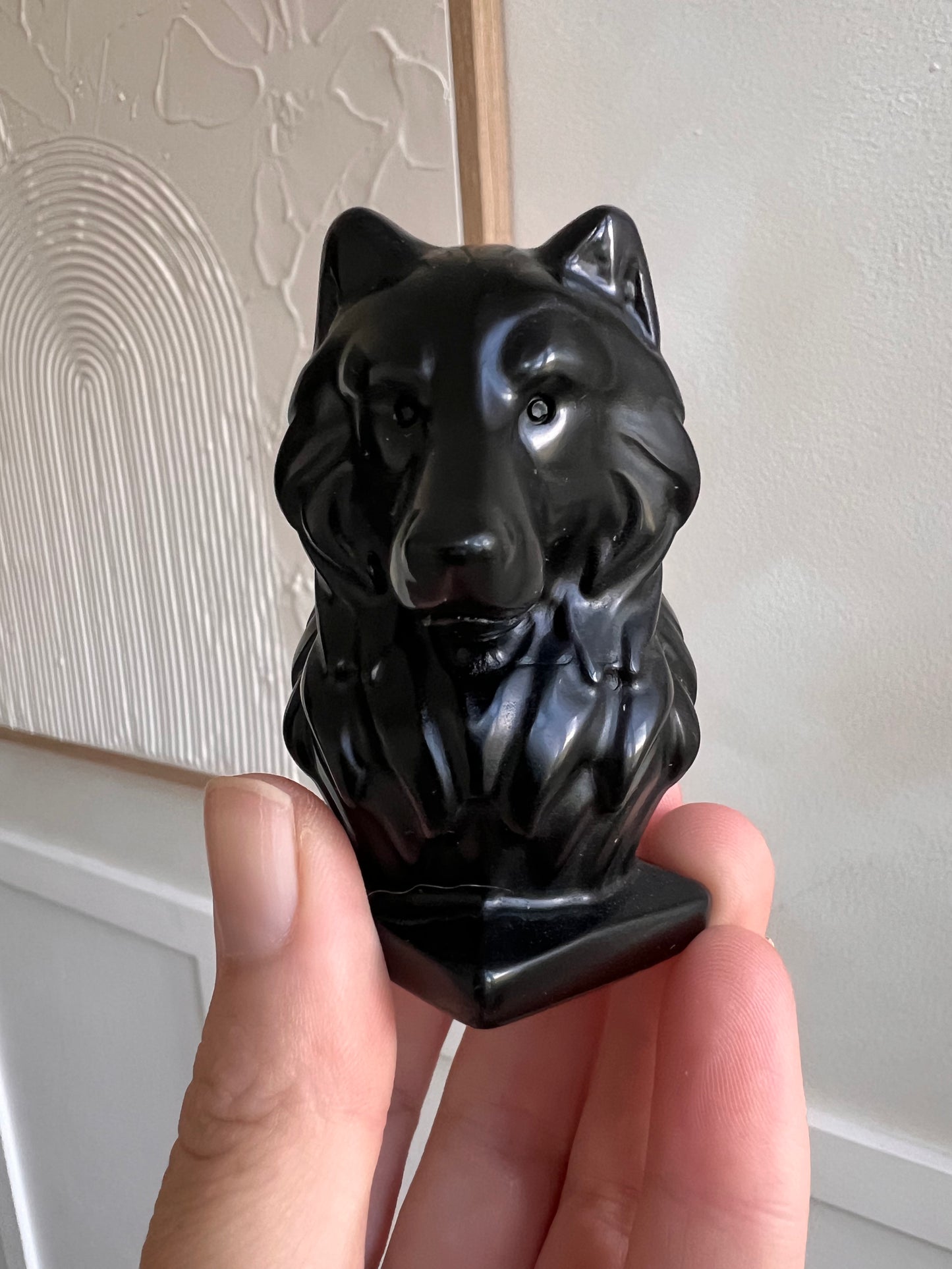 Black obsidian wolf carving stands