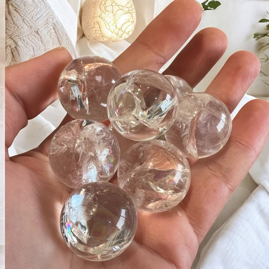 Rainbow filled clear quartz spheres intuitively chosen
